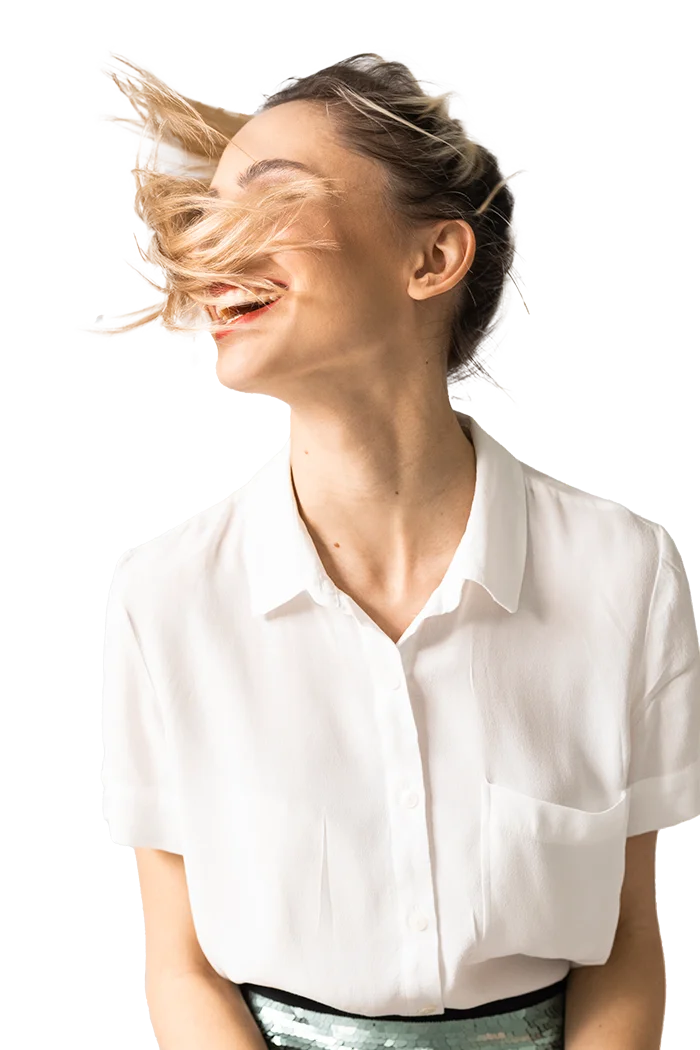 Happy girl with styled hair by Essential Salon team